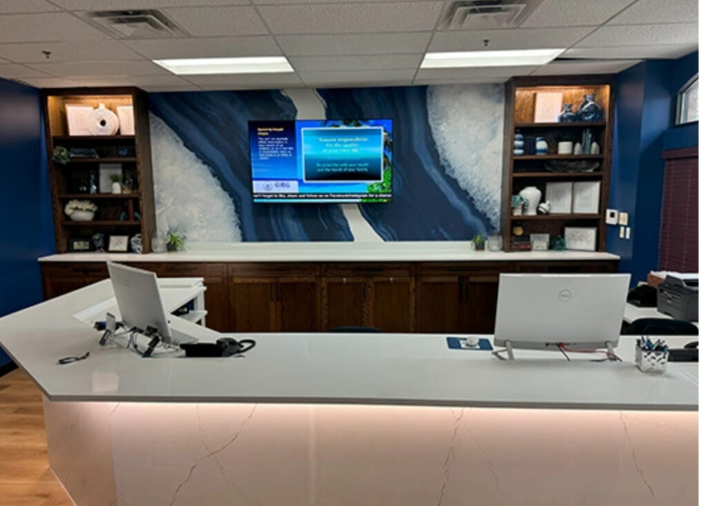 Front desk and reception area at Global Chiropractic Plano Frisco welcoming patients for chiropractic care