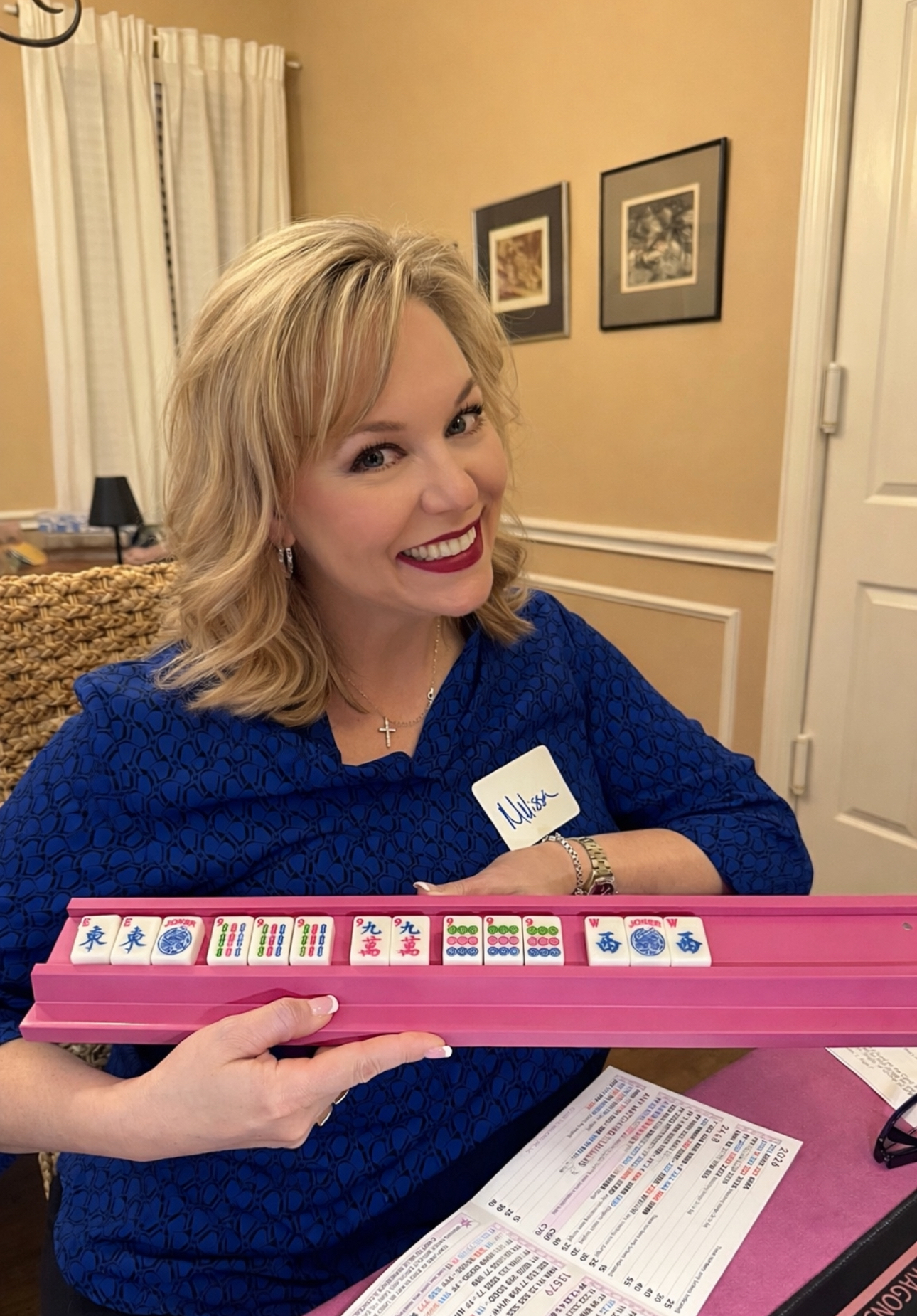 Dr. Melissa Shelton smiling while playing Mahjong with friends