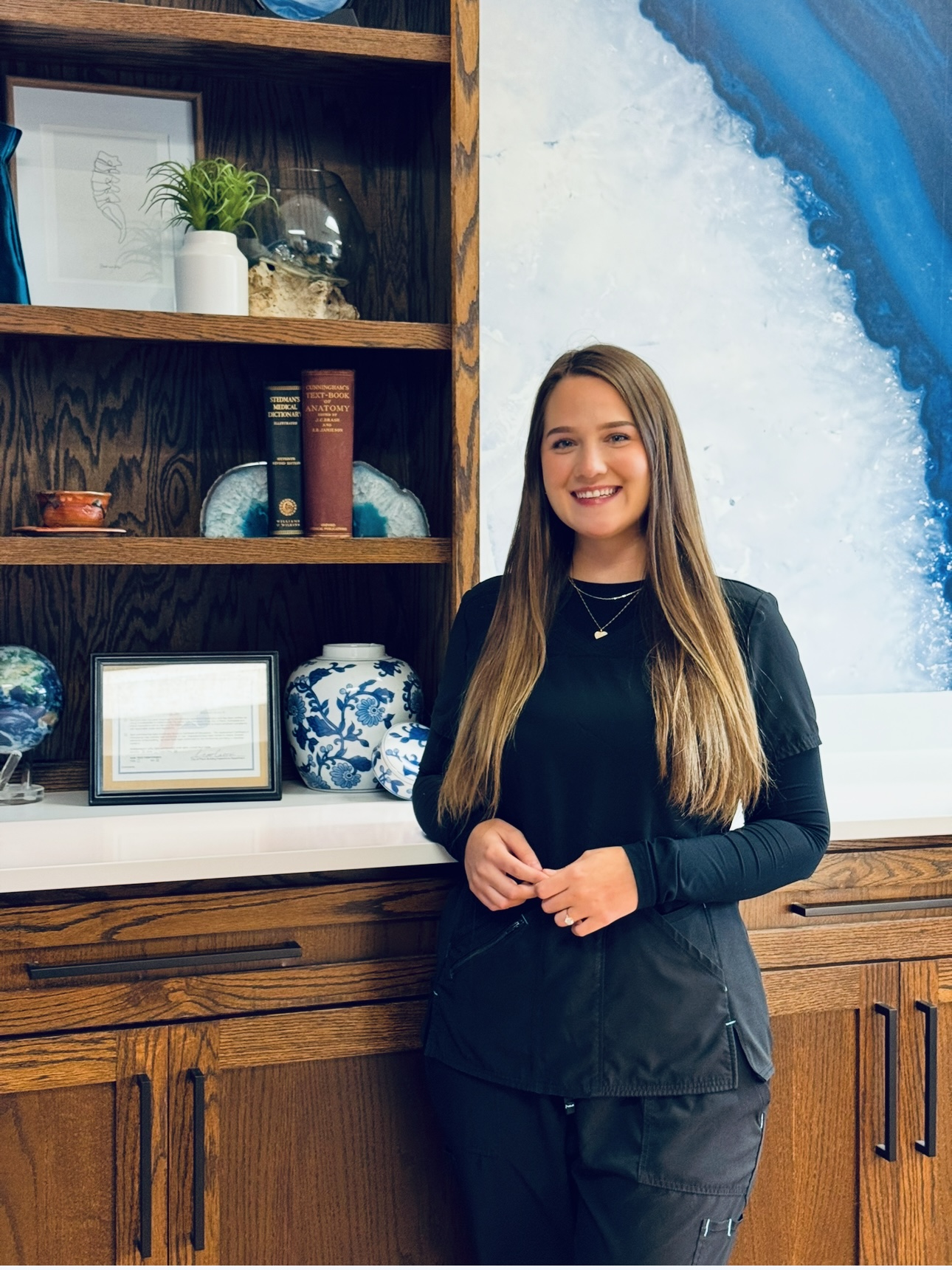 Kay team member at Global Chiropractic Plano Frisco assisting with patient care and front office support